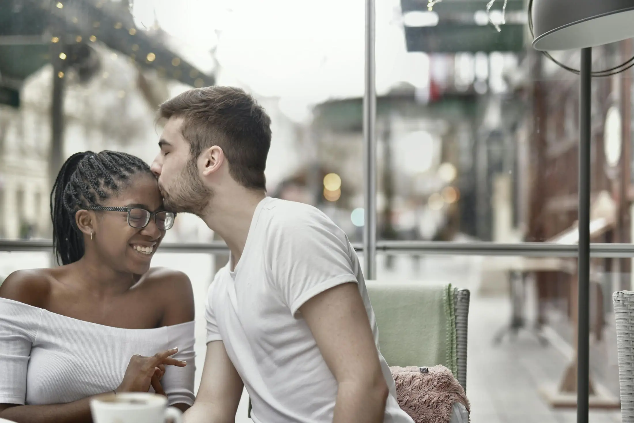 Couple sitting together in a cafe