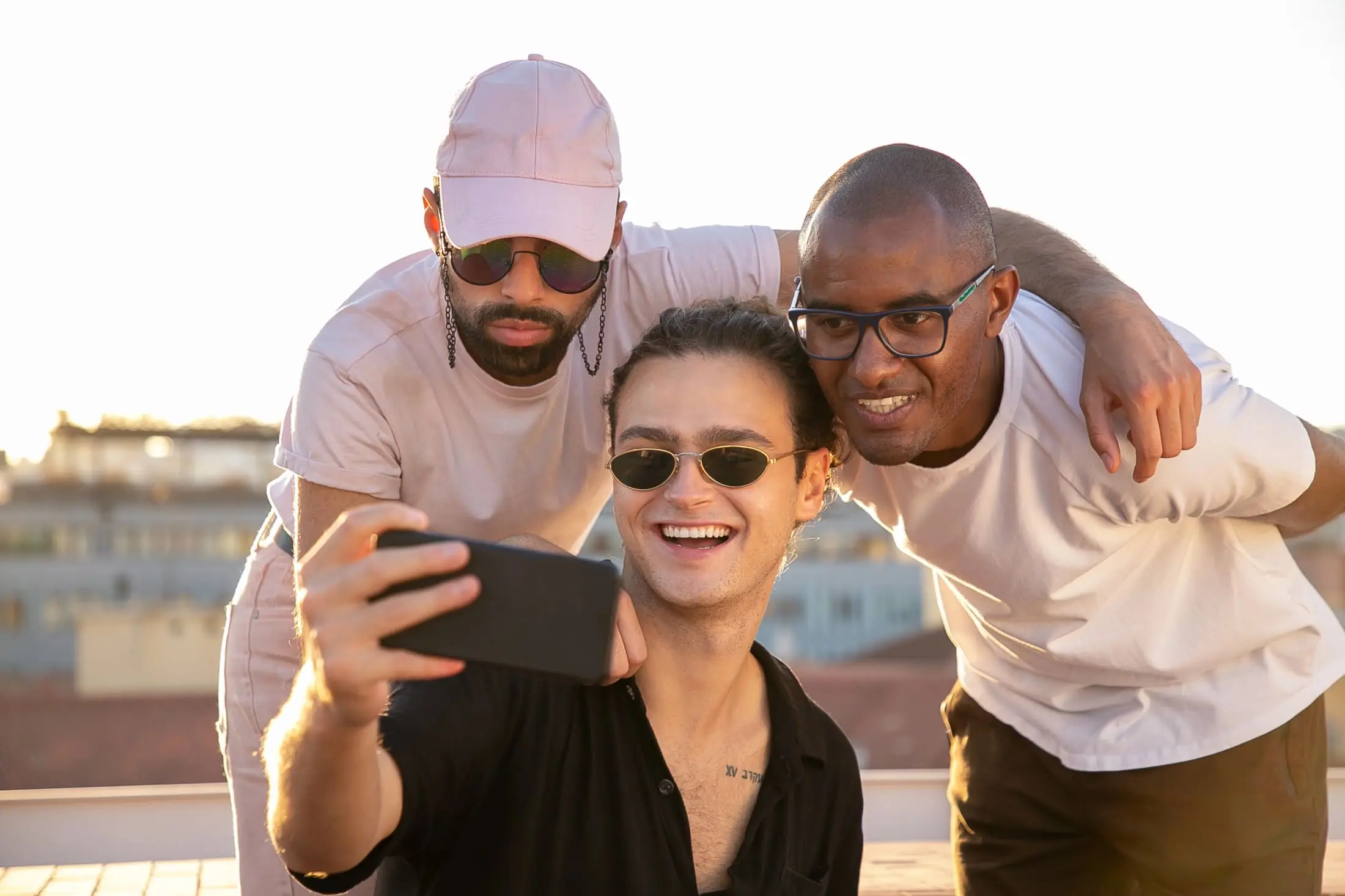 Friends taking a selfie on a rooftop