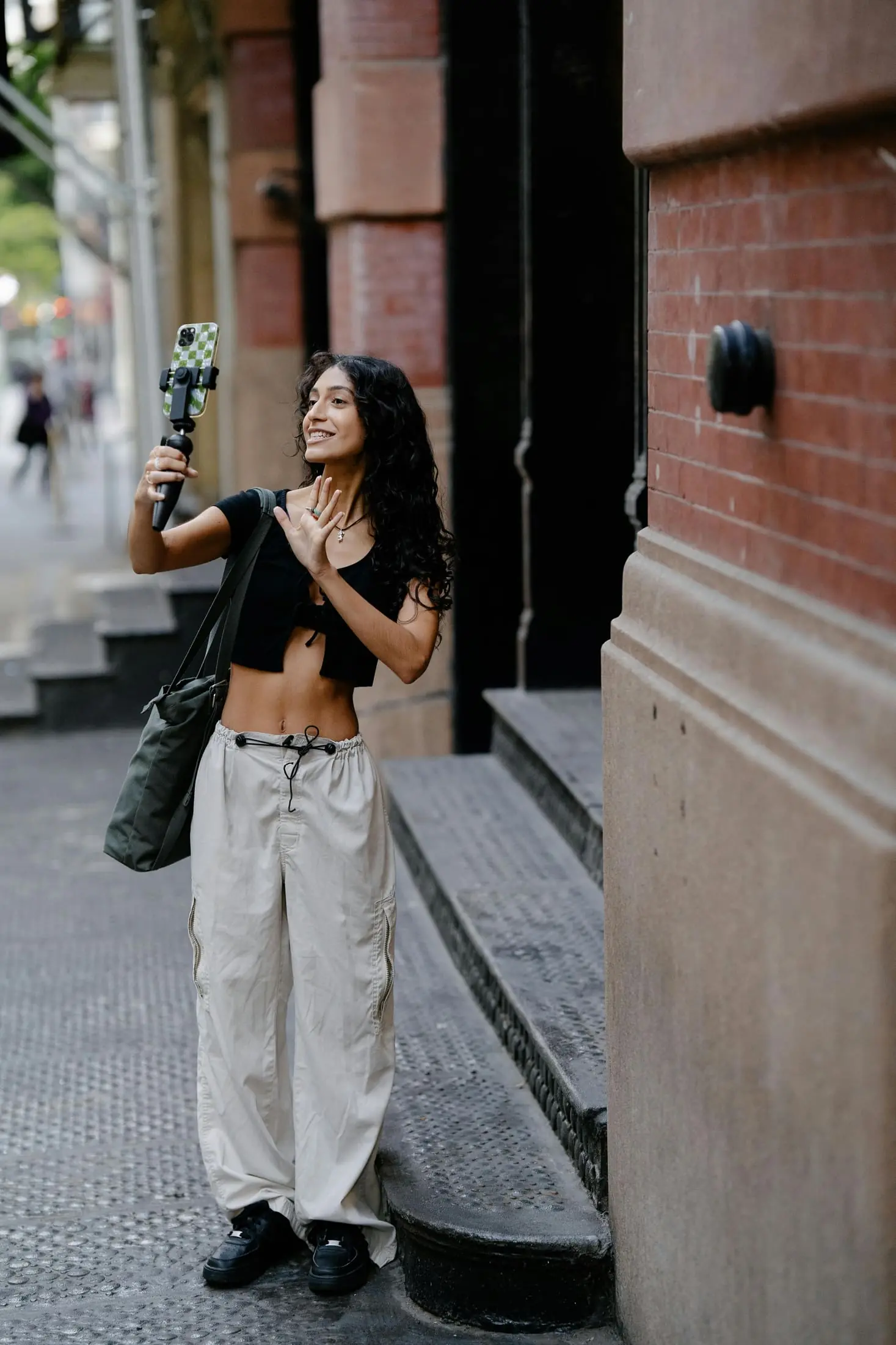 Person filming a street selfie